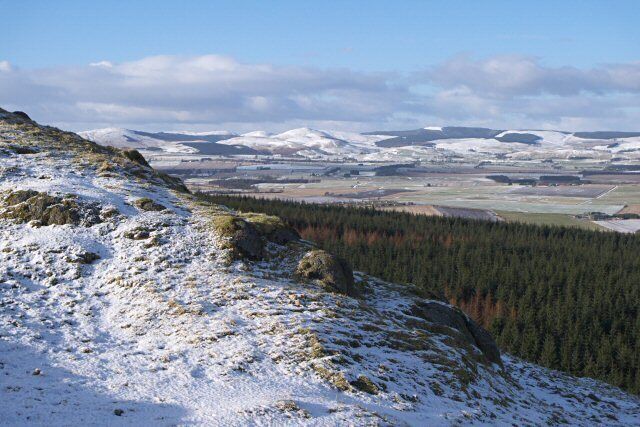 On Dummiefarline Although Dummiefarline is a modest rocky outcrop, it gives good views. In this direction you can see over Crook of Devon to the eastern end of the Ochils. The conical hill in the centre of the picture is Mellock Hill. Lendrick Hill is to the left.