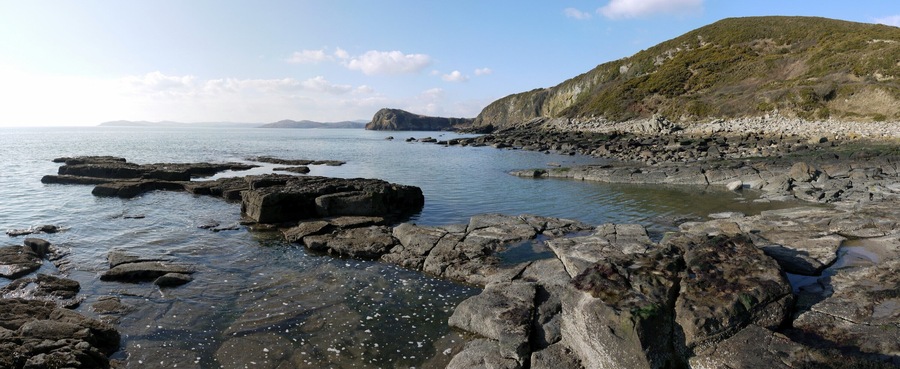 Coastal scenery west of Glenstocken Sands. Castlehill Point (locally Castle Point) 1464000, in the centre of the panorama, juts out below Barcloy Hill.
