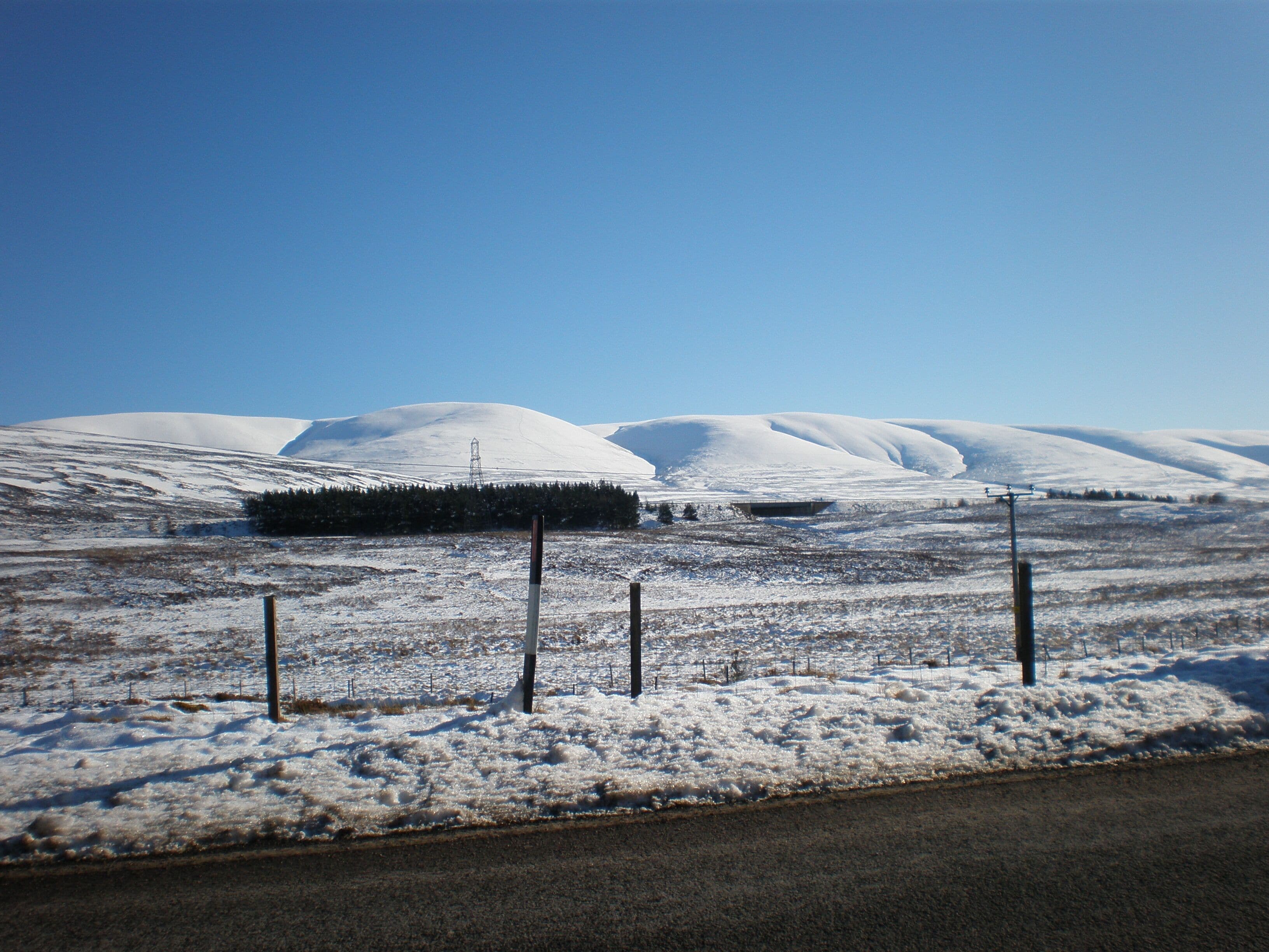 Looking across A9 to Leacainn and Carn na Caim from near Dalwhinnie Distillery