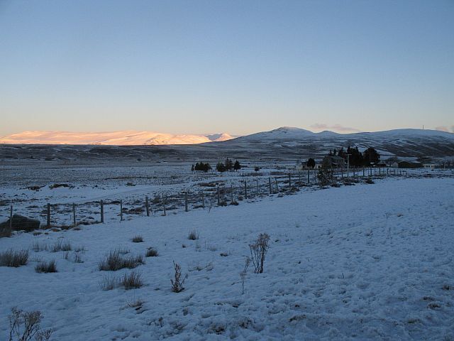 Alpenglow, Cuaich Cuaich is still in the shadow of the Monadh Ghaig, but the Monadhliath hills are lit by the rising sun.