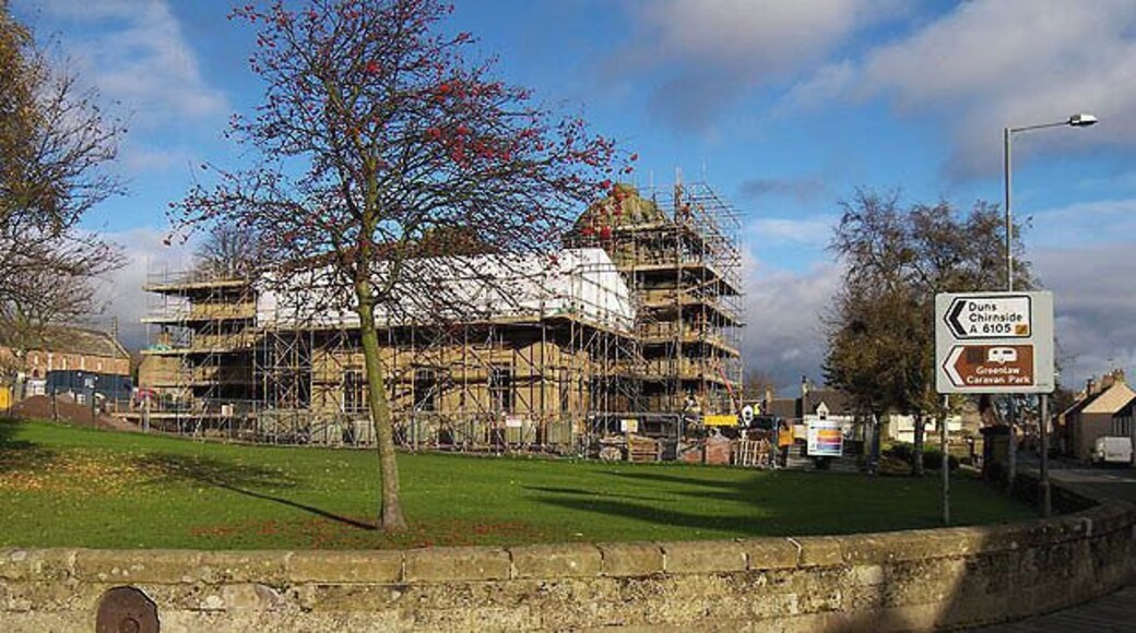 Renovation work at Greenlaw Town Hall. The hall was built between 1829 and 1831 to a Neo-Grecian design by John Cunningham when Greenlaw was the county town for Berwickshire. It was converted into a community centre in 1960 and a swimming pool in 1973 before falling into disuse in the 1990s. The hall featured in the BBC 'Restoration' programme in 2006 and although it was unsuccessful in securing funding from this source, European Redevelopment Fund money has been secured for the restoration of this impressive building. The programme of works is expected to be completed by August 2010. For a view of the hall prior to the erection of scaffolding for the renovation work, see 1041653. An update on the funding campaign for this project:- Historic Scotland made a £500,000 grant towards the overall estimated project cost of £2 million on the condition that the remaining money was raised within a deadline. A local landowner sold off some land for housing and generously donated £255,000 to the fund, and the local community, through fundraising and other successful grant applications, managed to raise the necessary money 2 days before the Historic Scotland grant was due to expire - a fantastic effort by a local community of 600 people. (Source: Scottish Borders Council community newspaper SBconnect).
