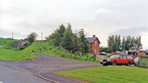 Greenlaw station (site/remains), 1997. View westward, towards Gordon, Earlston and St Boswells: ex-NBR Berwickshire (Reston - Duns - St Boswells) line. The line was severely affected by the great floods of 12/8/48, when 6.28 inches of rain fell in the Borders, turning rivers to raging torrents which destroyed many bridges. With track washed away as well, from 13/8/48 the line was closed Duns - Earlston, but was restored Greenlaw - St Boswells after some months for freight traffic, until complete closure from 19/7/65.