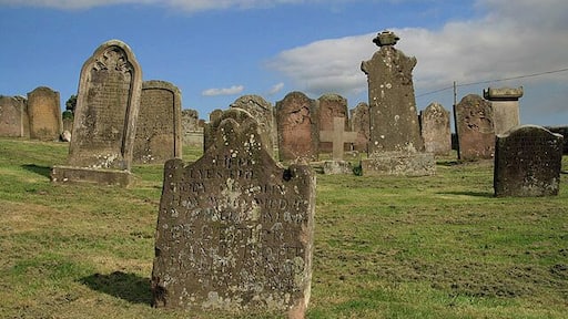 Chirnside Parish Church graveyard An interesting mix of headstones at the corner of the square. 4 squares converge in this graveyard. The kirkyard was the site of a famous resurrection in 1764 when Marjorie Halcrow Erskine, the second wife of the Revd Henry Erskine, was laid to rest in a shallow grave by the sexton who later returned to steal her jewellery. While he was trying to cut off her finger to steal a ring, the corpse awoke and dashed off across the kirkyard to the manse door, which she pleaded the minister to open ยFor Iยm fair clemmed wiยthe cauld.ย Apparently, in her additional years of life, she gave birth to two sons, Ralph and Ebenezer Erskine, who founded the Secession Church. The fate of the sexton is not known