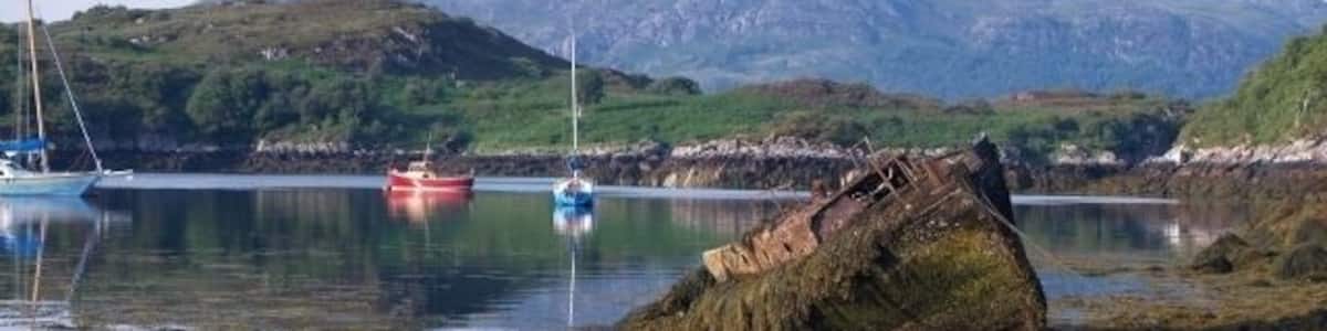Boats, Badachro. Taken from near the Badachro Inn. The hill in the middle distance is the island Eilean Horrisdale.