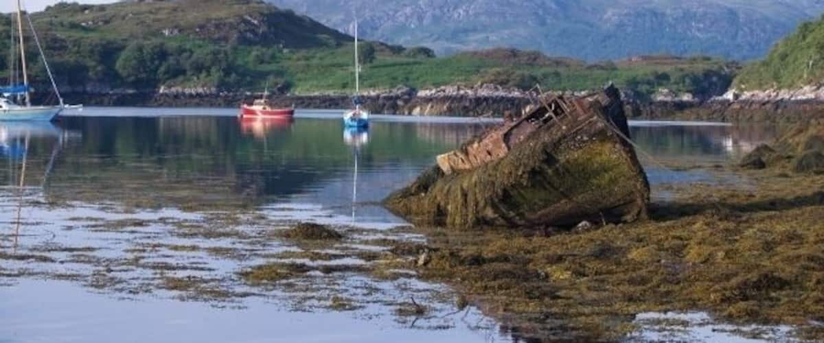 Boats, Badachro. Taken from near the Badachro Inn. The hill in the middle distance is the island Eilean Horrisdale.
