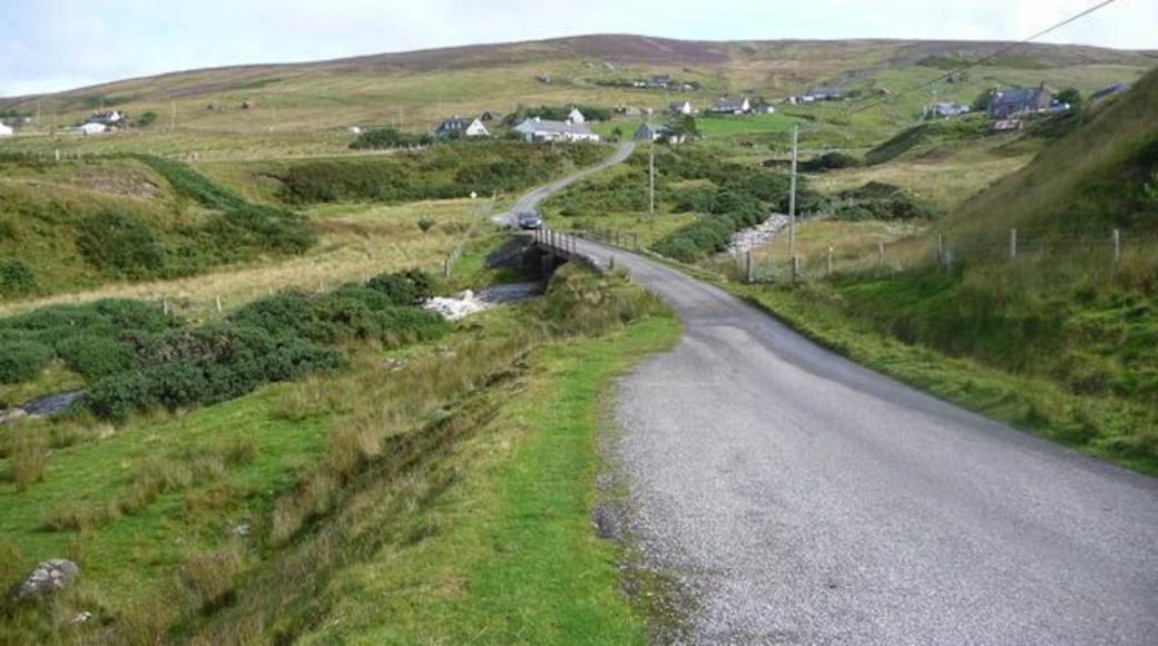 Melvaig village Single-track road crosses a small stream approaching the village of Melvaig.