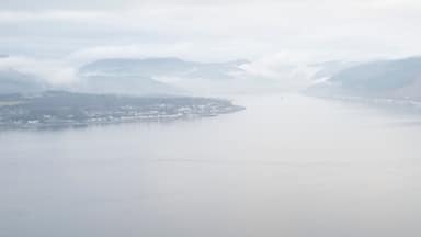 Ferry ship crossing on open vast ocean cruise journey aerial view from above during atmospheric weather sea island trip Scotland UK