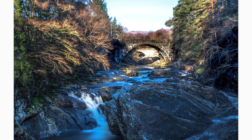 a sunny morning looking up the River Garry falls