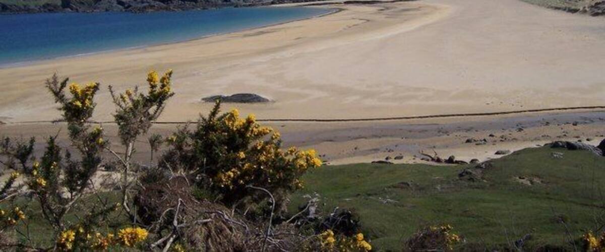 Kiloran Bay and Carnan Eoin. Kiloran Bay on an idyllic May morning, with not a soul to be seen.