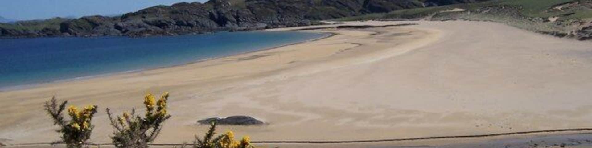 Kiloran Bay and Carnan Eoin. Kiloran Bay on an idyllic May morning, with not a soul to be seen.