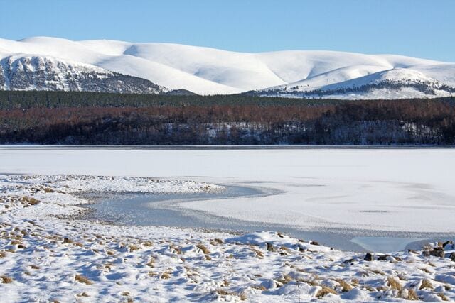 Loch Insh and the Glenfeshie Hills Looking across the southwestern end of the frozen loch towards the hills east of Glen Feshie.