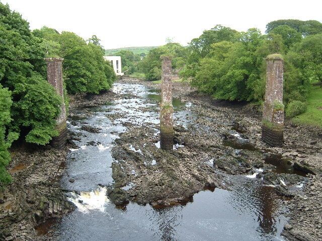 A view of the Dee and hydroelectric power station taken from Tongland Bridge on June 18th, 2005. The piers in the foreground are the remains of a disused railway bridge, part of a branch line to Kirkcudbright. They were pulled down in early August, 2005.
