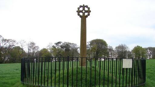 Merkland Cross, Kirtlebridge The Merkland Cross (Historic Scotland) is a fine 15th century 3m/9.9ft high wayside cross complete with floriated head. Its commemoration is unknown. The cross stands just above the southbound carriageway of the A74(M) near Kirtlebridge.