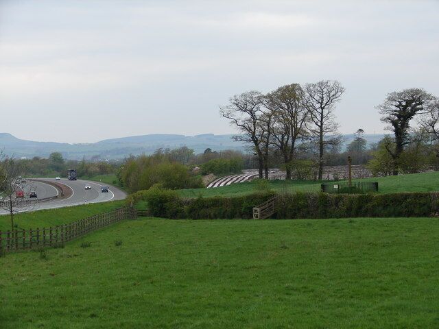 Merkland Cross & Motorway The Merkland Cross (Historic Scotland) stands in a field near Kirtlebridge, where it has been long before a road was build, let alone the modern A74(M).