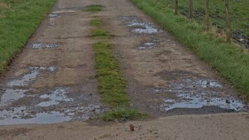 Concrete farm road Fauldingcleuch Farm.