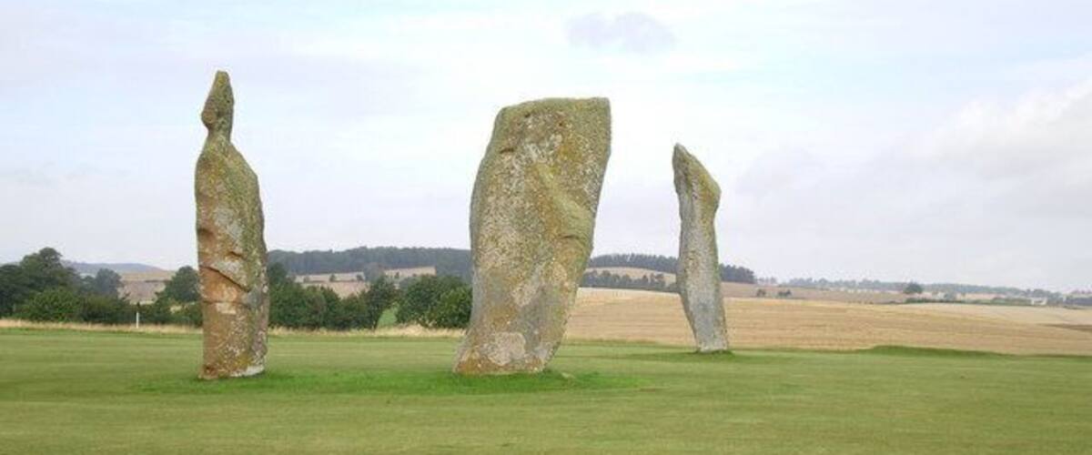 The Standing Stones on the Ladies Golf Course The notes prepared by the Golf Club admit that they know relatively little about the stones. It's possible that these are the remains of a circle, as a 4th stone was present in the late 18th century; however since this was broken at that time, and only the base remained in the ground, the position of that 4th stone is no longer known. Early 18th century reports also make note of several possible cist burials in the area of the stones, but again they're not well documented. Clearly an important Bronze Age site, and hopefully it'll remain preserved on the golf course for many years to come.