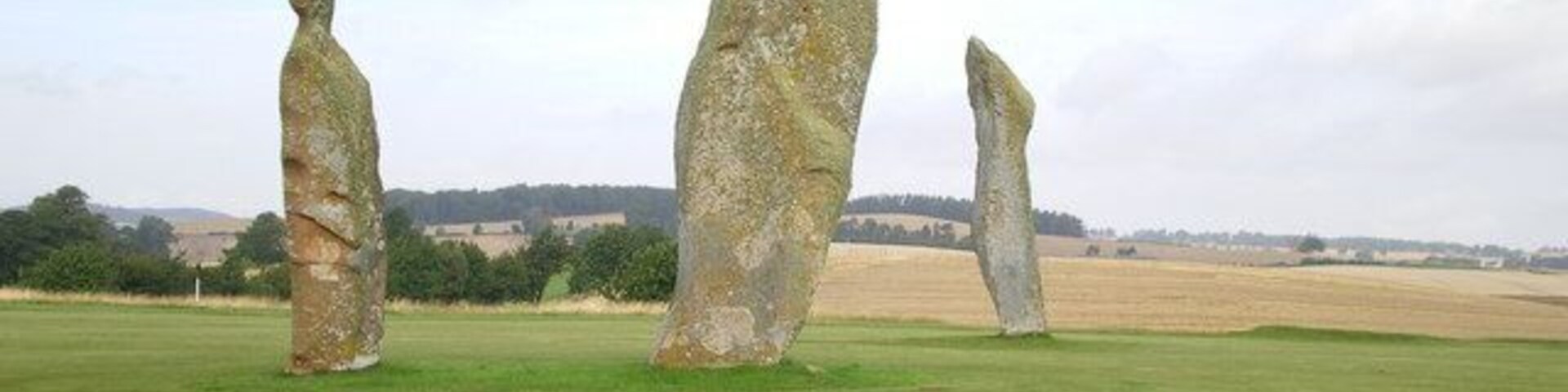 The Standing Stones on the Ladies Golf Course The notes prepared by the Golf Club admit that they know relatively little about the stones. It's possible that these are the remains of a circle, as a 4th stone was present in the late 18th century; however since this was broken at that time, and only the base remained in the ground, the position of that 4th stone is no longer known. Early 18th century reports also make note of several possible cist burials in the area of the stones, but again they're not well documented. Clearly an important Bronze Age site, and hopefully it'll remain preserved on the golf course for many years to come.