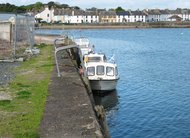 Harbour wall, Garlieston This view looks along the harbour wall, over the bay to Garlieston.