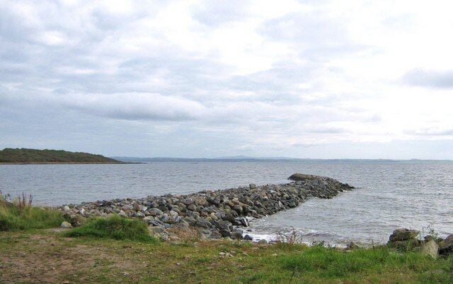Breakwater, Garlieston Bay. This is a Victorian breakwater at the approach to Garlieston Bay. Eggerness Point can be seen on the other side of the approach.