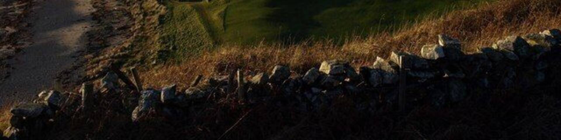 St Medans Golf Course The prominent hill is called the Lag. St Medans is a 9 hole course, opened in 1905 and cost £90 to lay out, with a further £71 being spent on building a clubhouse. (Donald Trump take note!)