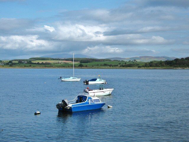 Garlieston Bay This view of Garlieston Bay is taken from the harbour wall, to the left of the jetty. Across the bay, Eggerness Woods can be seen on the right.