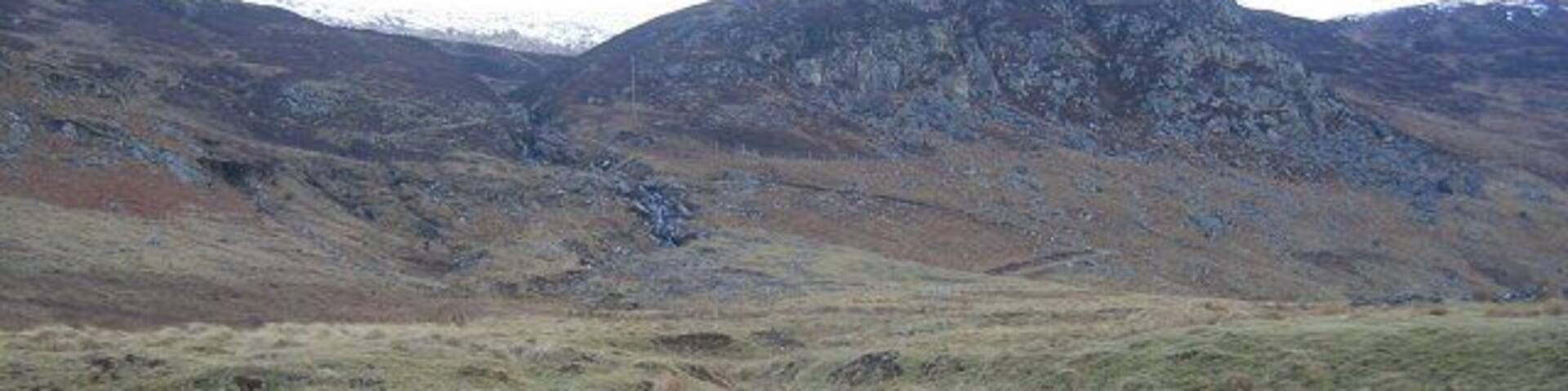 Creagan Soilleir. Craggy hillside above Laggan. The end of the improved farmland.
