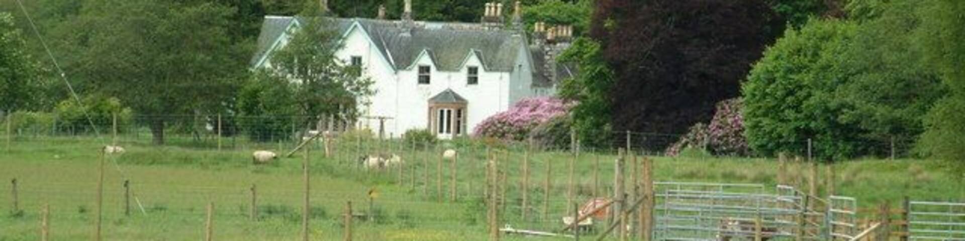 Strathmashie House. As seen from near the A86 bridge over the River Mashie