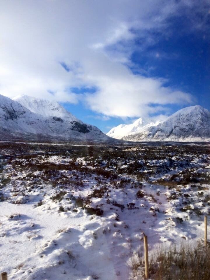 A snowy mountain landscape with a clear sky.
