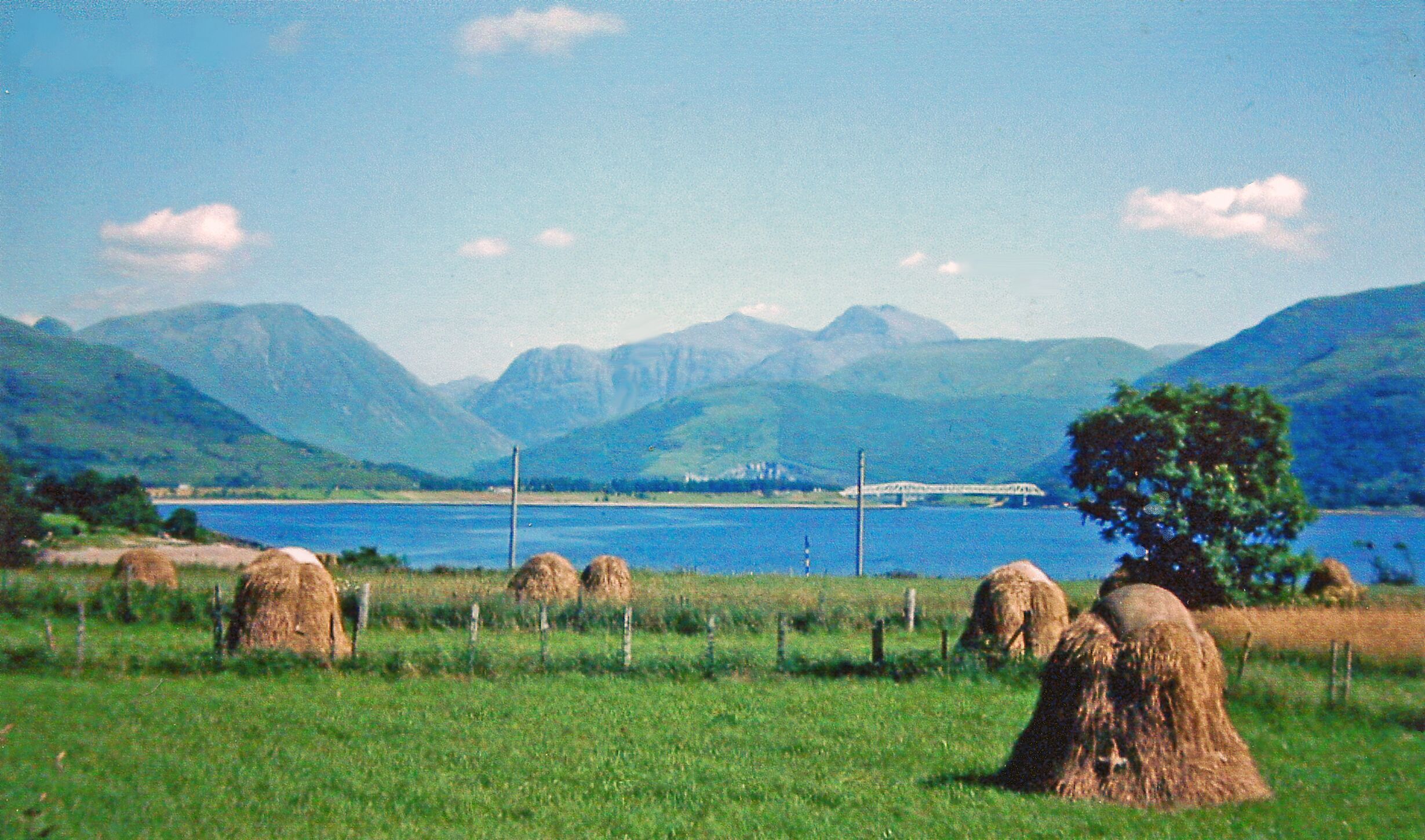 Eastward view in 1976 from Onich to new A82 bridge over Loch Leven at Ballachulish. A splendid sight up the water to the mountains of Glencoe, the highest peaks being Sgor nam Fiannaidh (3,168 ft.) and Bidean nam Bian (3,766 ft.).
