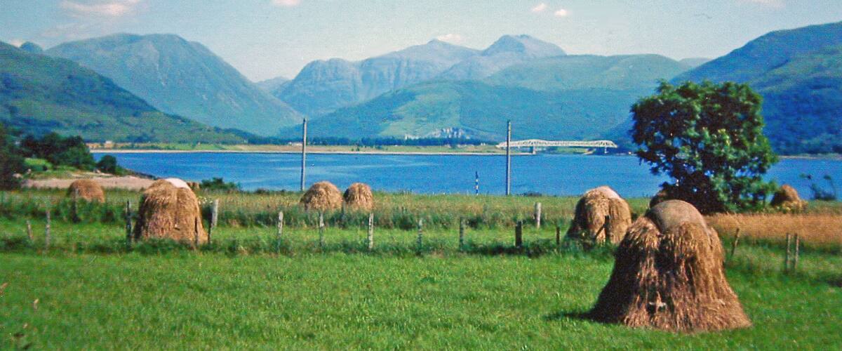 Eastward view in 1976 from Onich to new A82 bridge over Loch Leven at Ballachulish. A splendid sight up the water to the mountains of Glencoe, the highest peaks being Sgor nam Fiannaidh (3,168 ft.) and Bidean nam Bian (3,766 ft.).