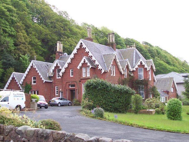 Red sandstone house. A substantial building with ornate gables and chimney pots. One of the few remaining red sandstone buildings on Shore Road, Skelmorlie.