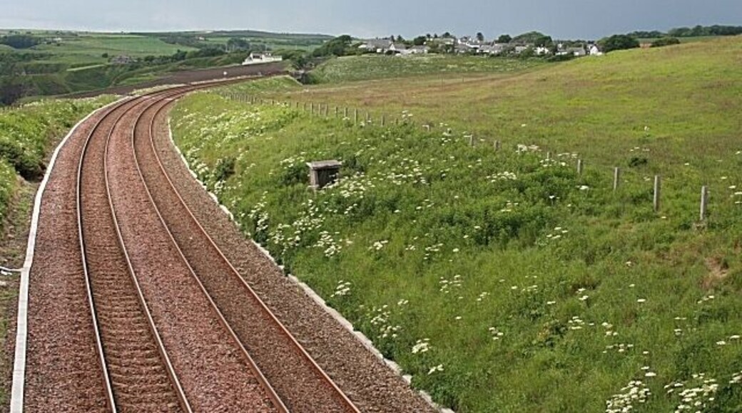 Railway Line at Muchalls Looking south from the overbridge at Mains of Monduff, the main railway to the south from Aberdeen curves round the village of Muchalls. It would have been better with a train in view, but I didn't want to wait any longer as it was about to rain - heavily!
