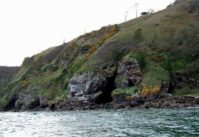 Cave and cliff close to Port an Righ The Easter Ross coastal scenery is rugged and unfrequented. There are many such rocky bluffs like this with impressive caves hollowed out by the pounding sea.