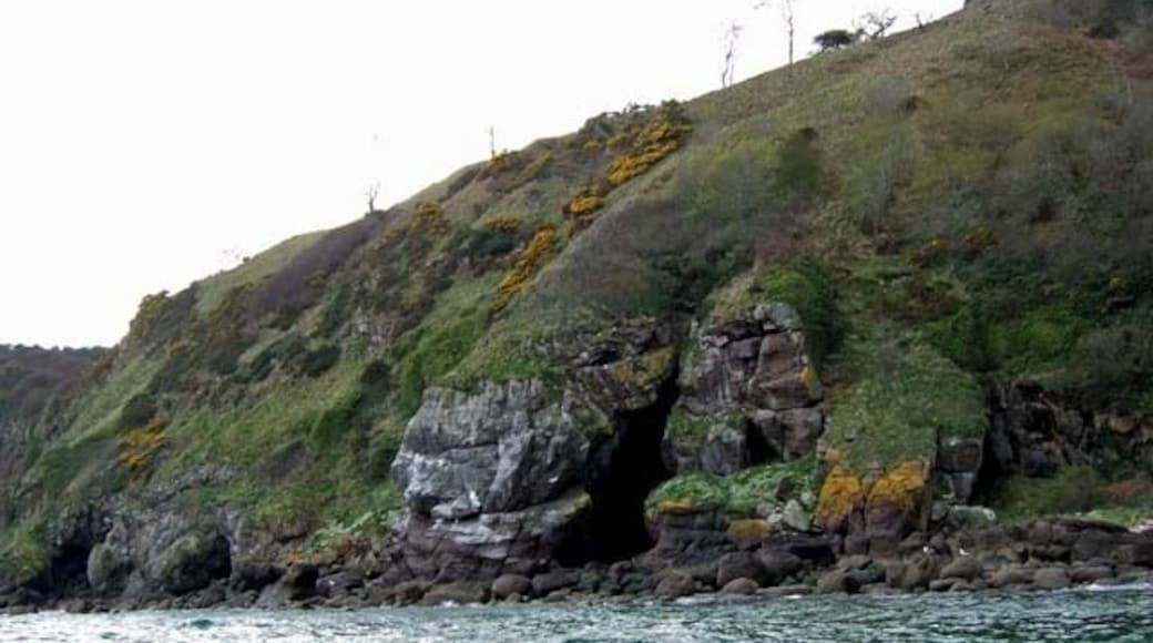 Cave and cliff close to Port an Righ The Easter Ross coastal scenery is rugged and unfrequented. There are many such rocky bluffs like this with impressive caves hollowed out by the pounding sea.