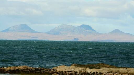The Paps of Jura seen from North Kintyre Looking across the Sound of Jura from Ronachan. Only 150 minutes and two ferry rides away!