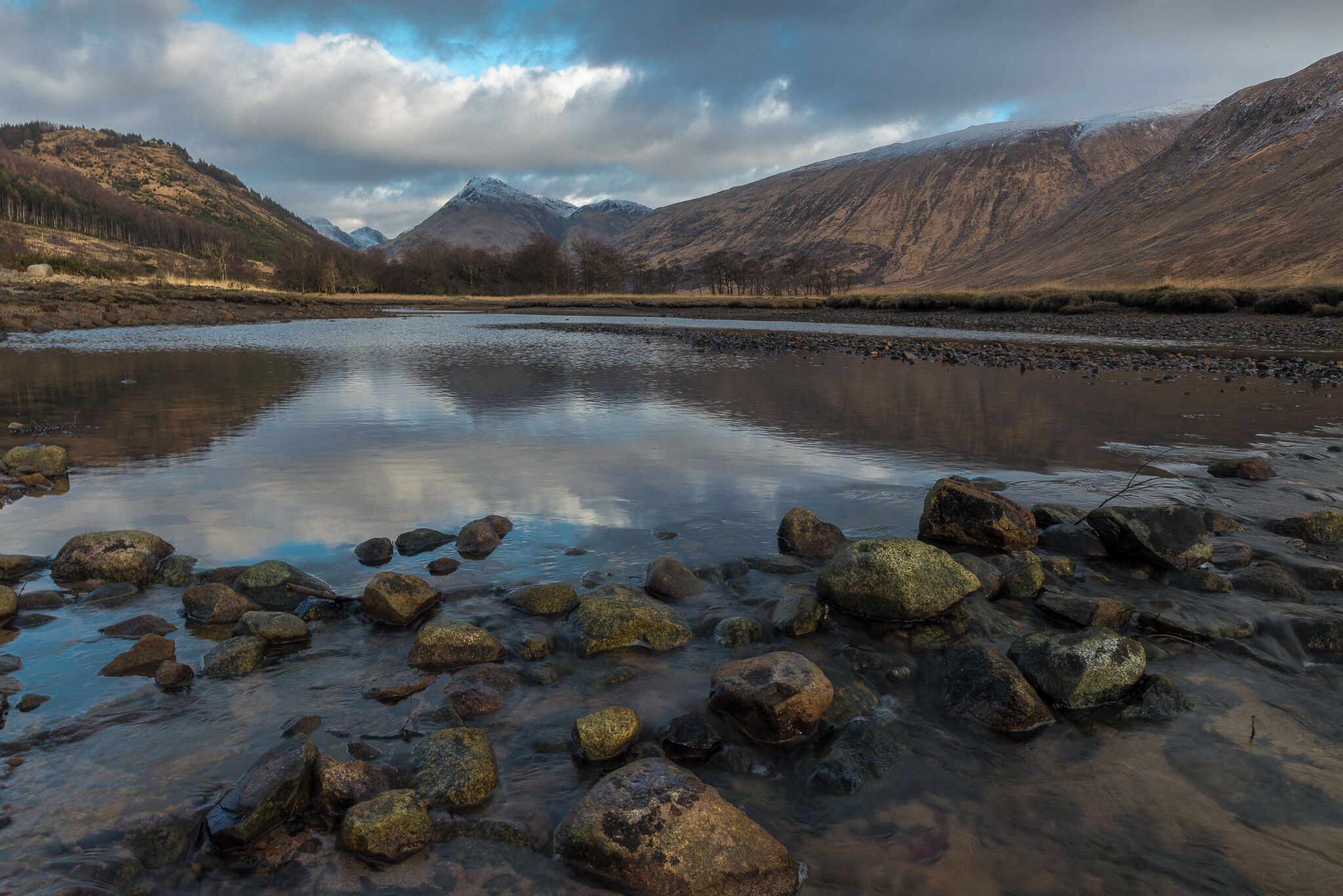 The north end of Loch Etive is dominated by the view up Glen Etive to the twin mountains of Buachaille Etive Mor and, to its west, Buachaille Etive Beag. The north ends of these twin ridges dominate the upper parts of Glen Coe, but from the south they appear as twin cones.

Loch Etive is accessible by car via a 14 mile drive down scenic Glen Etive along a minor road that starts at the head of Glen Coe.  

And binoculars should be an essential companion on a journey up Loch Etive. The seals that have hauled themselves out onto the rocks in the loch are easily visible. But it is often more difficult to spot the deer on the hillside, the golden eagles swooping over Beinn Trilleachan or the sea eagles now increasingly being seen here.


#hiddenscotland #discoverscotland #glencoe #glenetive #igscotland #ig_scotland #scotland_insta #scotland_ig #uk #perspectives #winter #walking #hiking #outdoors #swimming #outdoorswimming #loch #water #sunset #mountains #munros #nature #scotland #uk #britain #travel #landscape