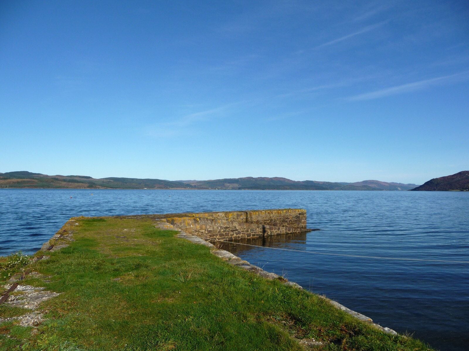Old Jetty at Otter Ferry Between the 18th century and as recently as 1948 a ferry operated across Loch Fyne between here and West Otter Ferry. The jetty and quay were built by James Campbell in the late 1700s. The name Otter derives from the Gaelic oitir - meaning a sandbank or spit of land. Near this point an Otir extends a mile out into the loch.