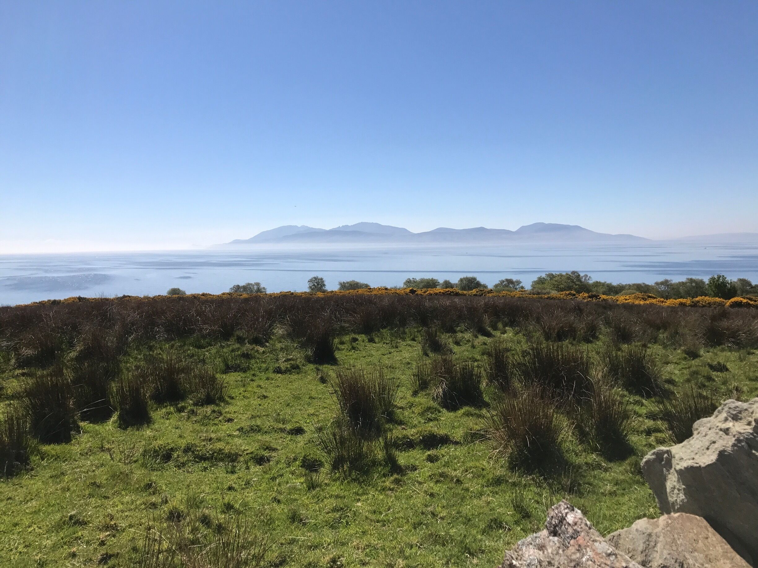 Isle of Arran swathed in mist  photographed from the Cowal Peninsula. Arran looks like the mythical Isle of Avalon