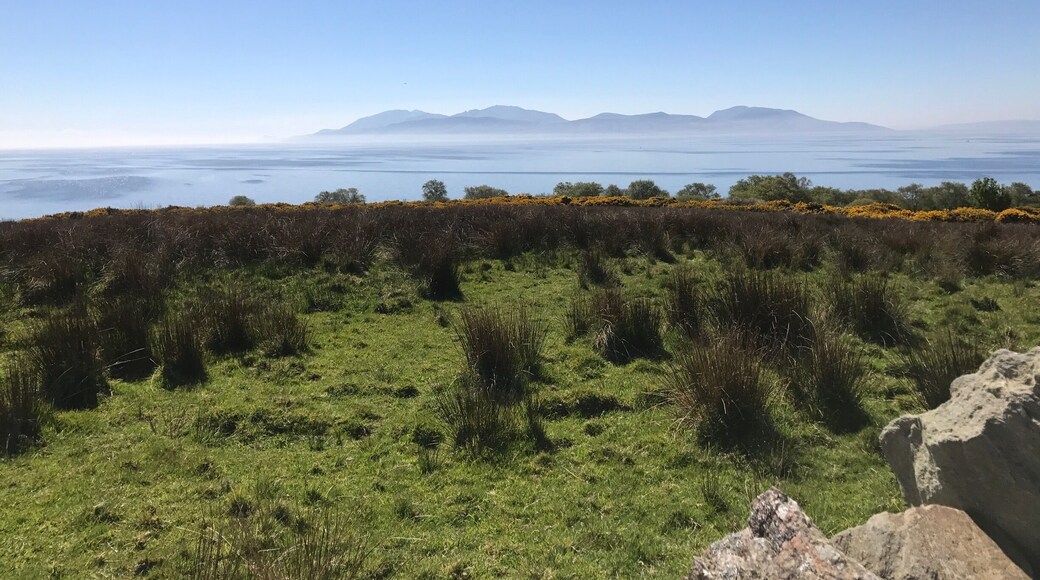 Isle of Arran swathed in mist photographed from the Cowal Peninsula. Arran looks like the mythical Isle of Avalon