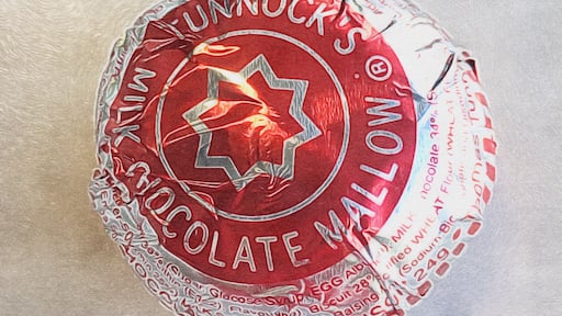 The Tunnocks Tea Cake, a Scottish institution to have with your cup of tea.
Inside the wrapper is a mallow topped biscuit covered in chocolate.