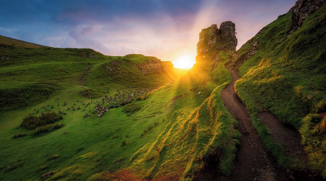 On the West side of Trotternish at Balnacnoc - above Uig, is the Fairy Glen – a Quirang-like landslip in miniature. The road winds around small round-topped grassy hills with lochans (ponds) in between which gives the glen an otherworldly feel.