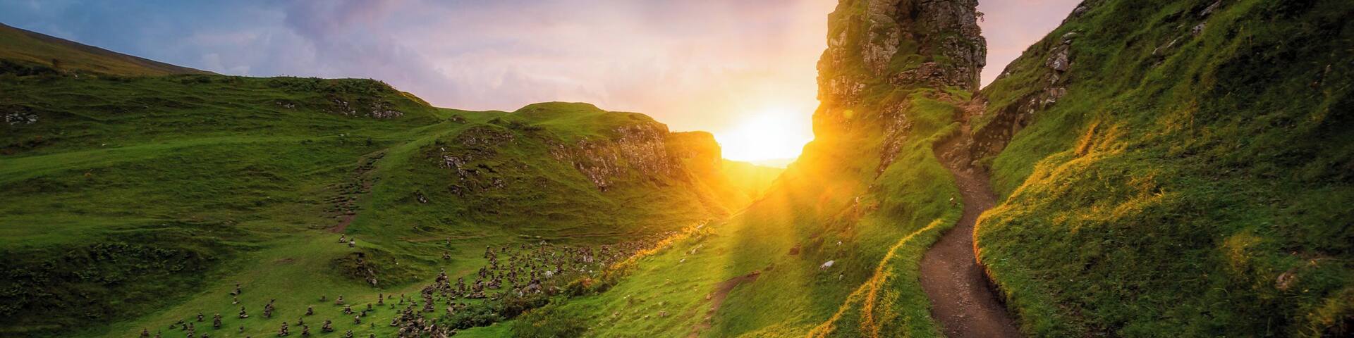 On the West side of Trotternish at Balnacnoc - above Uig, is the Fairy Glen â a Quirang-like landslip in miniature. The road winds around small round-topped grassy hills with lochans (ponds) in between which gives the glen an otherworldly feel.