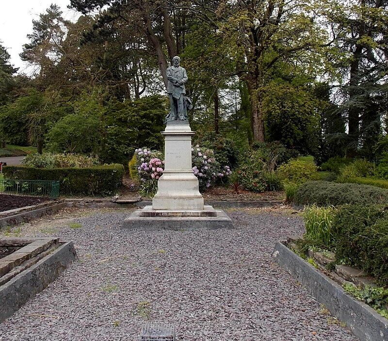 Bronze statue on a pedestal in Aberdare Park, Aberdare