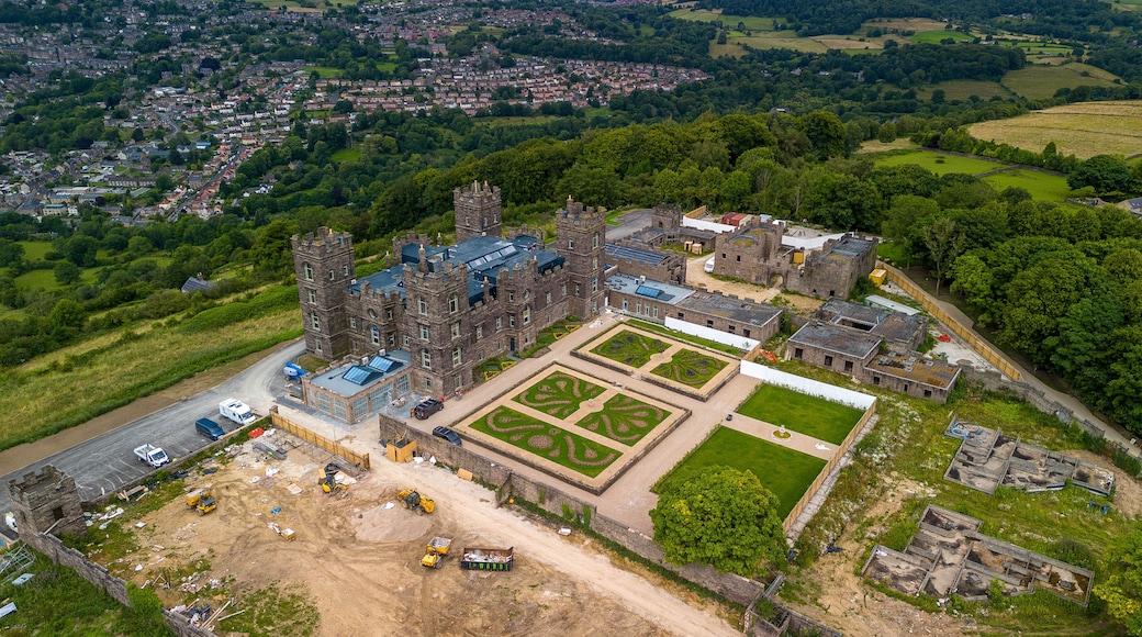 Aerial View of I'm a Celebrity's Gwrych Castle and Gardens Undergoing Restoration with Urban Landscape Beyonu