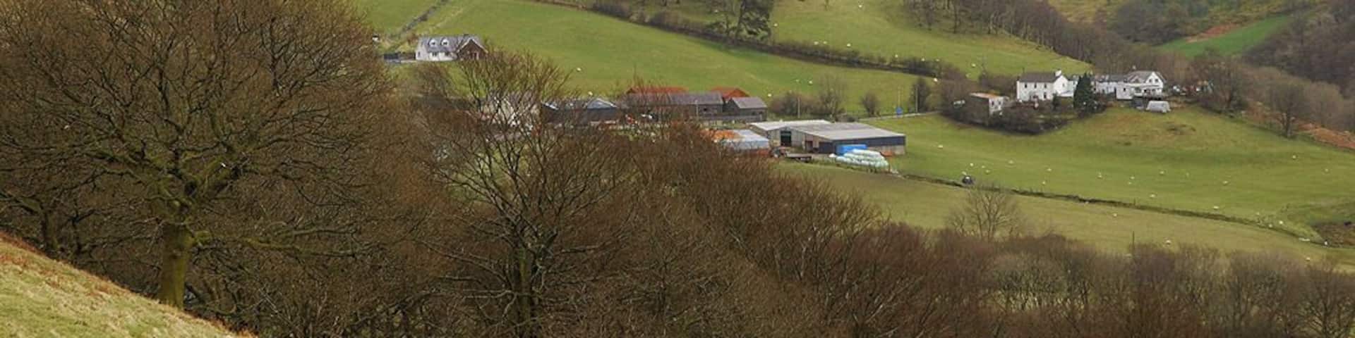 Cwmystwyth seen from the west Cwmystwyth is a fairly scattered community, the farm and nearby houses are about as dense as it gets, although there is another small group of houses just down the road from where the photograph was taken.