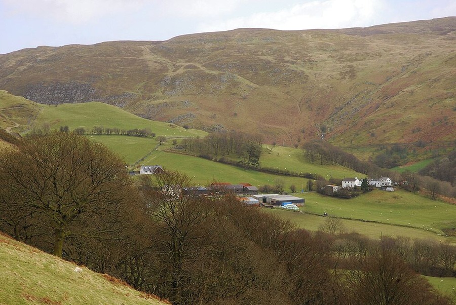 Cwmystwyth seen from the west Cwmystwyth is a fairly scattered community, the farm and nearby houses are about as dense as it gets, although there is another small group of houses just down the road from where the photograph was taken.