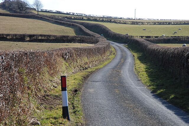 Minor road east of Chancery Heading due south to eventually link with the B4576, serving a number of farms in the area.