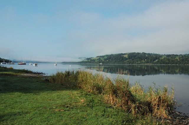 The cruising fleet on their moorings, Llyn Tegid. A distant view of the 'White House' and the morning mist rising above the Bala Sailing Club, Cruiser Fleet, moored on Llyn Tegid..