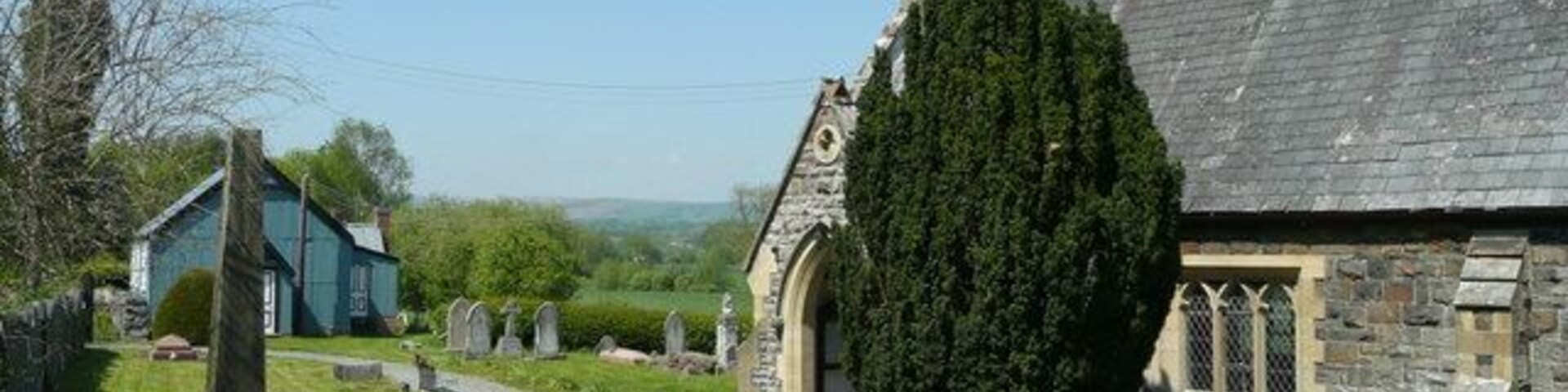 St. Gwrhais church and hall, Penstrowed Showing the juxtaposition of the two buildings.