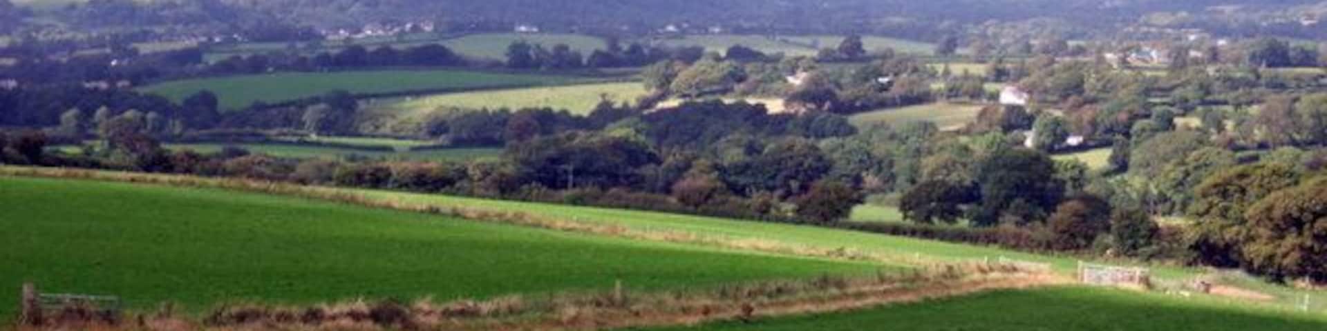 Aberteifi over the fields The road between Rhoshill in the east and Eglwyswrw in the west runs along the northern Preseli escarpment providing spectacular views over the Teifi valley. In this one, looking NNW, the town of Cardigan and the Teifi estuary can be seen in the distance.